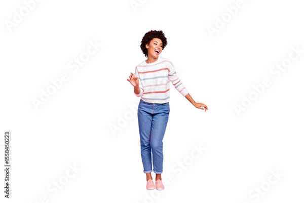 Fototapeta Full length photo of pretty dark skin lady at dancing party moving with favorite song rhythm wear striped pullover and jeans isolated pastel pink color background