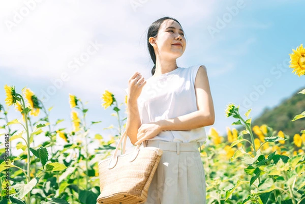 Obraz Solitude and freedom woman standing relax in sunflower botanical field park outdoors with sunlight