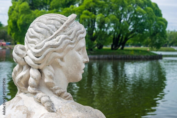 Fototapeta The Bird's isle at the Upper pond and the head of the scuplture of Sphinx in Tsaritsino park and reserve in Moscow, Russia