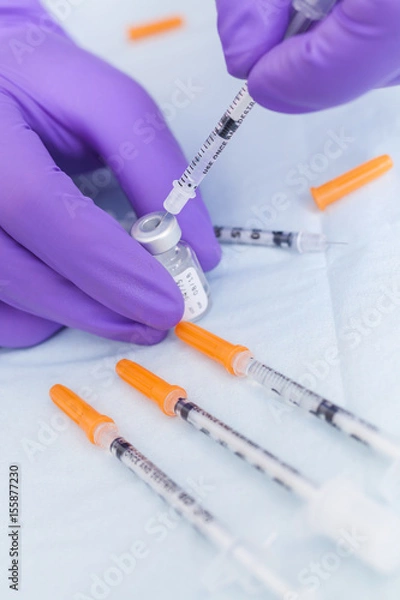 Obraz Cosmetic Surgeon Doctor Filling Botox Syringe From Vial