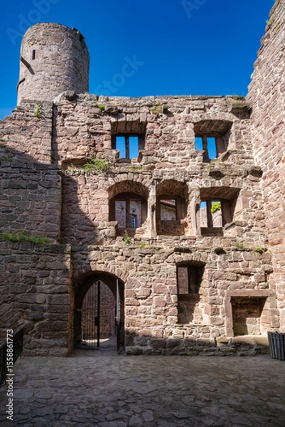 Fototapeta The Majestic and Enigmatic Ruins of an Ancient Castle are Beautifully Surrounded by Lush Greenery