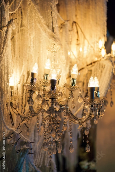Fototapeta Elegant crystal chandelier with warm light decorative in wedding backdrop