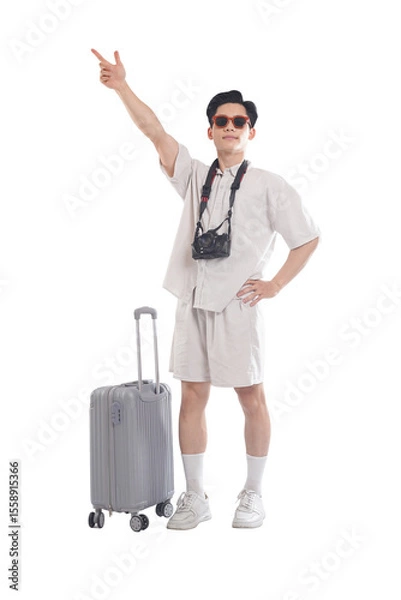 Fototapeta Adventurer's Journey Begins: An enthusiastic tourist, camera in hand, prepares for an adventure with suitcase, sunglasses, gesturing excitedly, embodying the essence of travel.