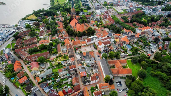 Fototapeta Aerial view of the old town of the city Schleswig, 24837 in Germany on an overcast day in afternoon