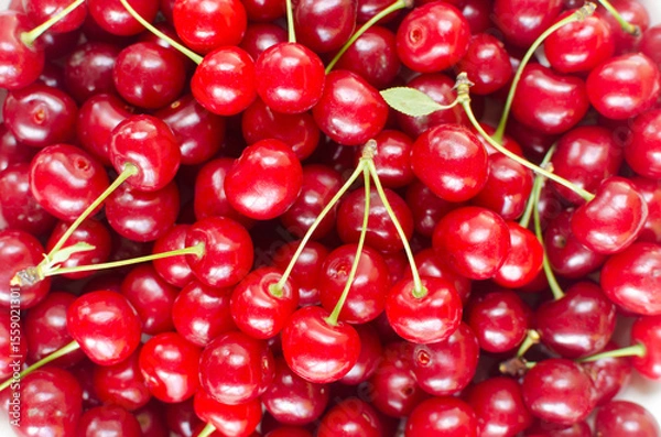 Fototapeta Ripe red cherries - background. Summer berries concept. Harvest. Horizontal orientation. Selective focus. Top view.