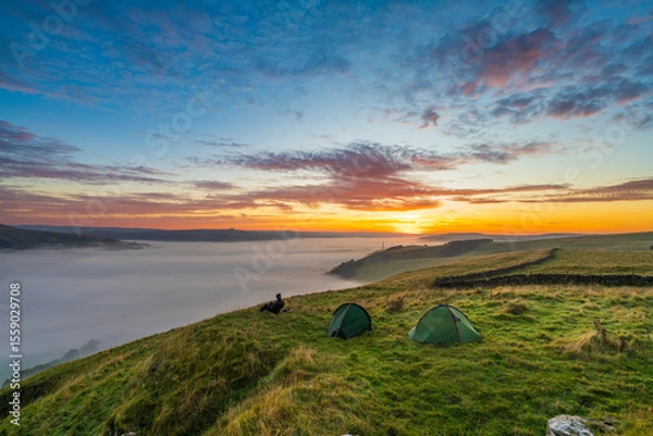 Fototapeta Winnats Pass peak at sunrise with cloud investion in the valley over Castleton. Peak District. England