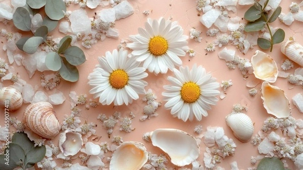 Fototapeta Close-up of chamomile flowers surrounded by stone tiles and tiny shells in tones of pastel peach dusty rose and eucalyptus green