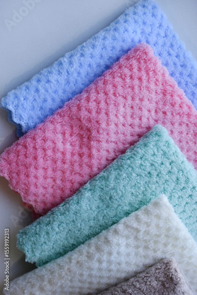 Fototapeta Multi-colored pile towels. A soft towel.