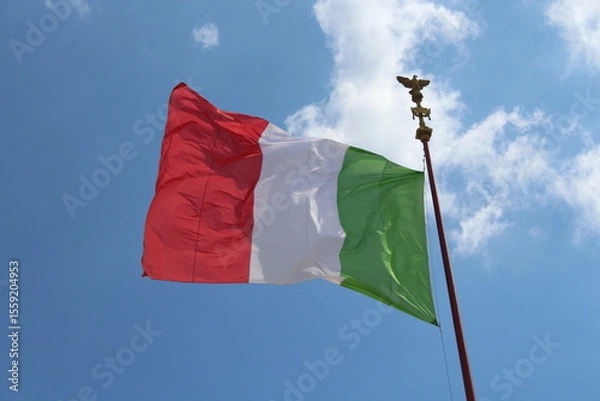 Obraz Italian flag in cloudy sky. waving in the sky. Italian flag in a wind on a cloudy blue sky background in Rome
