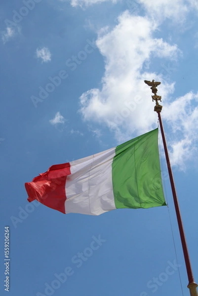 Obraz Italian flag in cloudy sky. waving in the sky. Italian flag in a wind on a cloudy blue sky background in Rome
