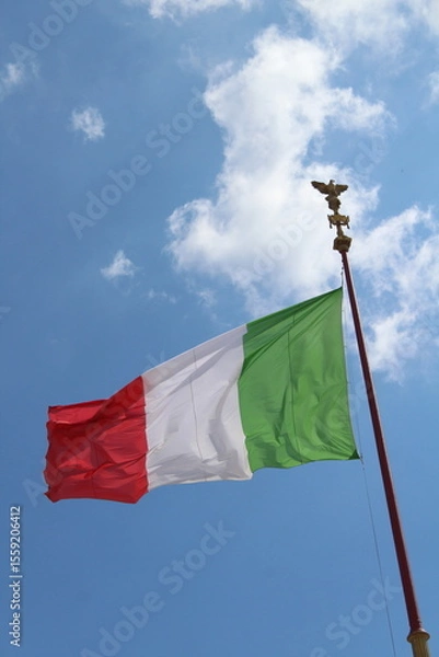 Obraz Italian flag in cloudy sky. waving in the sky. Italian flag in a wind on a cloudy blue sky background in Rome