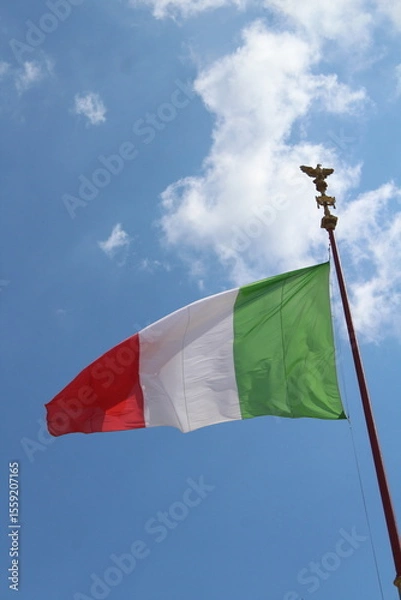 Obraz Italian flag in cloudy sky. waving in the sky. Italian flag in a wind on a cloudy blue sky background in Rome