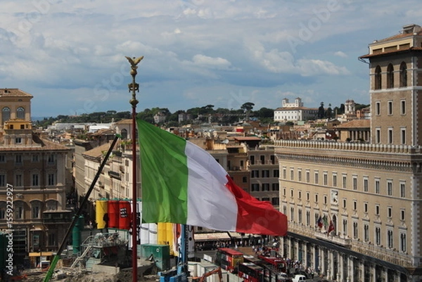 Obraz Italian flag waving in wind with Rome in Background 