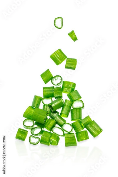 Obraz Freshly chopped green onion slices falling in mid-air isolated on white background, cooking and garnish ingredient concept