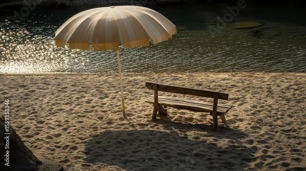 Fototapeta Serene Beach Scene with Umbrella and Simple Wooden Bench at Sunset