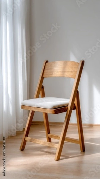 Fototapeta Modern Wooden Chair with Cushioned Seat in Sunlit Room