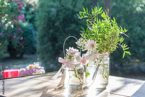 Obraz Vase fleurie en verre transparent