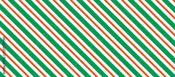 Fototapeta Bold vector pattern featuring diagonal stripes in green, orange, and white, creating a vibrant and energetic visual perfect for backgrounds, textiles, or modern design elements.