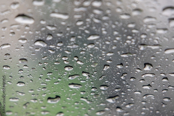 Obraz close-up, full-frame shot of numerous water droplets of varying sizes clinging to a glass surface