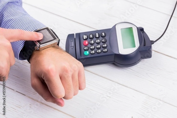 Fototapeta Man using smart watch to express pay