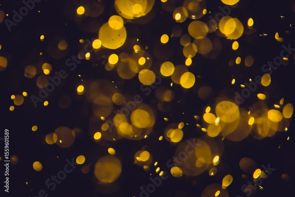 Obraz Defocused  golden bokeh lights in various sizes and colors on a dark background creating a dreamy and abstract visual effect