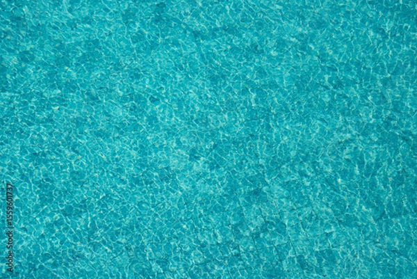 Obraz Vibrant blue water surface with shimmering reflections and ripples under sunlight