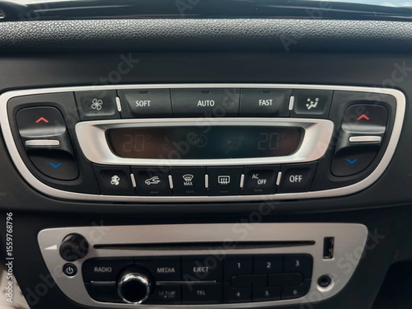 Fototapeta Modern vehicle dashboards encompass a wide array of innovative features that enhance climate control and audio management, which significantly improve both comfort and entertainment during travel