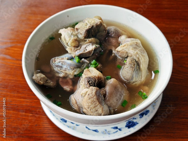 Fototapeta fresh stewed pork in the soup in the bowl for eating