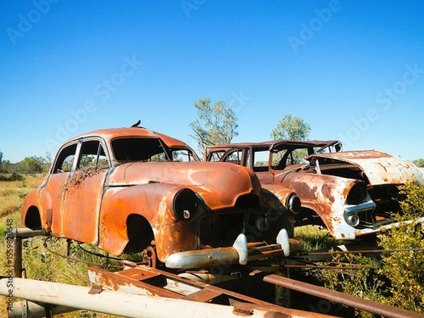 Obraz old rusty car in the field