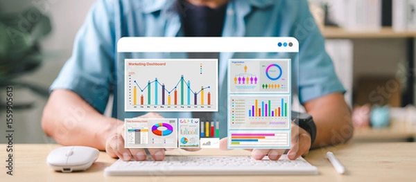 Fototapeta Marketer using digital marketing dashboard with charts, pie graphs, organization chart, and performance data. Concept of business analytics and strategic planning.