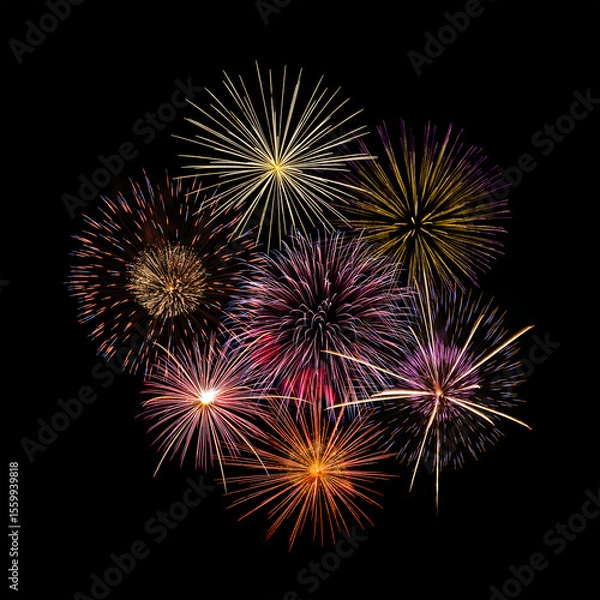 Fototapeta Fireworks of various colors and shapes burst in night sky