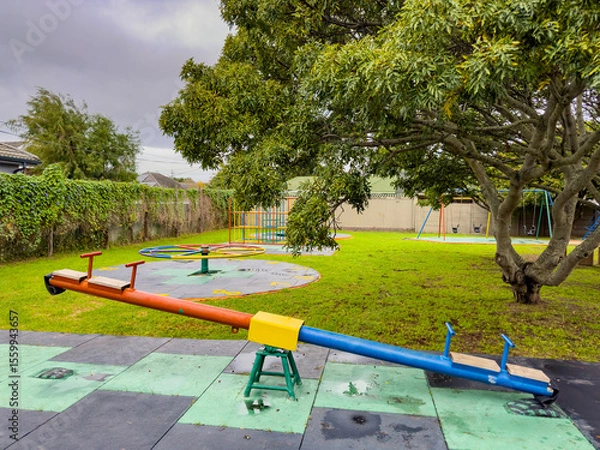 Fototapeta Public children's playground park on a cloudy day