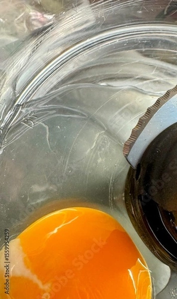 Fototapeta Top view of raw egg in food processor