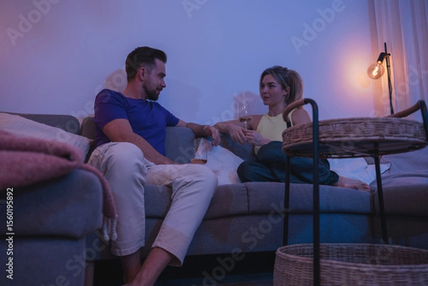 Obraz Relaxed Couple Enjoying Wine at Home in the Evening
