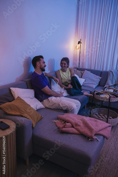 Obraz Relaxed Couple Enjoying Wine at Home in the Evening