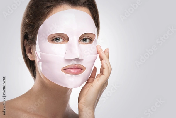 Obraz Woman Using Bio-Collagen Deep Hydration Sheet Mask for Skin Brightening and Firming
