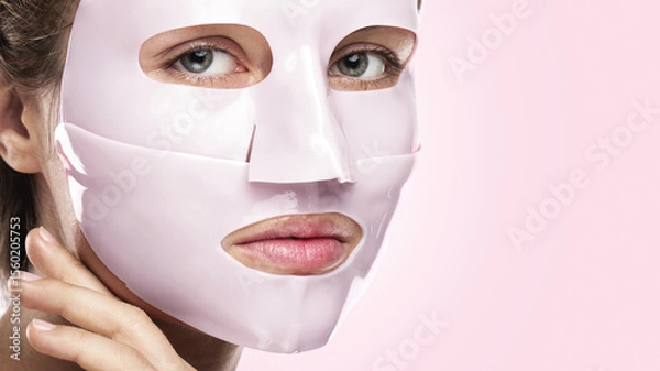 Obraz Woman Using Bio-Collagen Deep Hydration Sheet Mask for Skin Brightening and Firming
