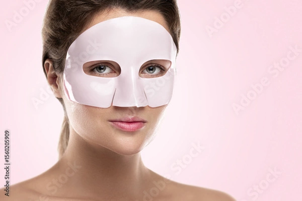 Obraz Woman Using Bio-Collagen Deep Hydration Sheet Mask for Skin Brightening and Firming