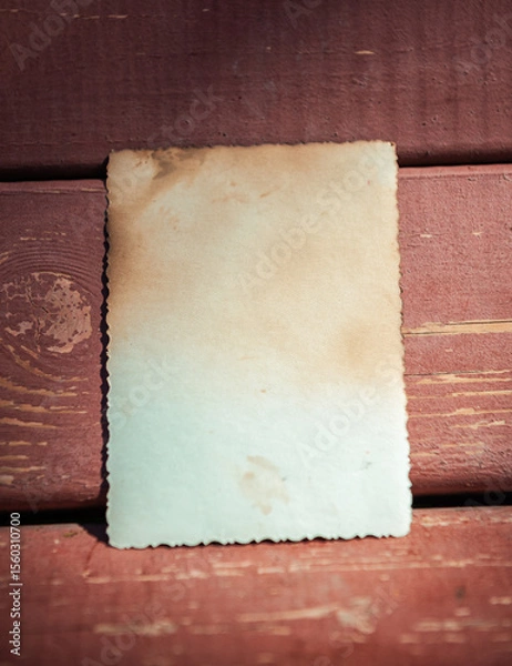 Obraz Vintage empty paper lies on the old wooden texture of bench