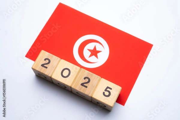Fototapeta 2025, Tunisia flag with date block, Concept, Important events for Tunisia the new year, election, economy, social activities, central bank, Tunisia foreign policy