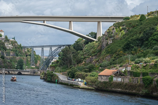 Fototapeta The Infante Dom Henrique bridge spanning the Douro river in Porto.  Built in 2003 it spans 280 arch.