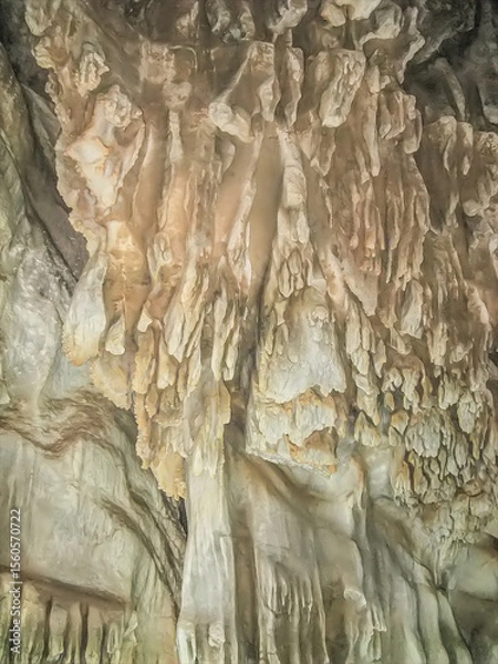 Fototapeta Abstract drawing of an underground cave with stalactites and stalagmites. Limestone karst formation. Travel and vacation concept. Digital painting. Abstract naturalism, relief pattern.