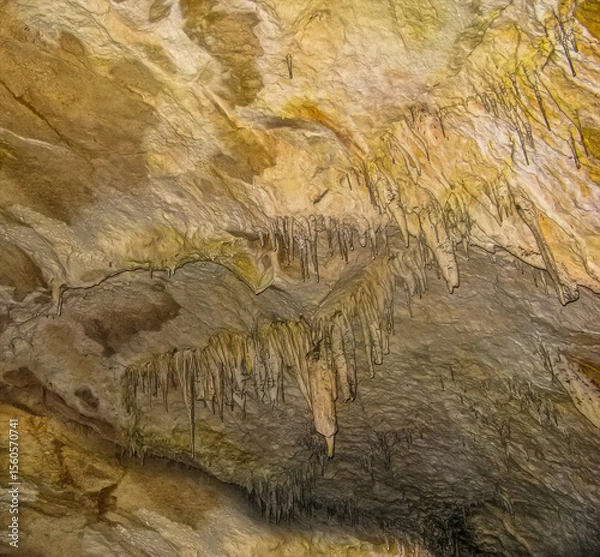 Fototapeta Abstract drawing of an underground cave with stalactites and stalagmites. Limestone karst formation. Travel and vacation concept. Digital painting. Abstract naturalism, relief pattern.