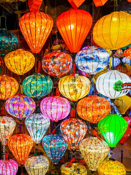 Fototapeta A kaleidoscope of traditional Vietnamese lanterns glowing in vivid colors during a market display
