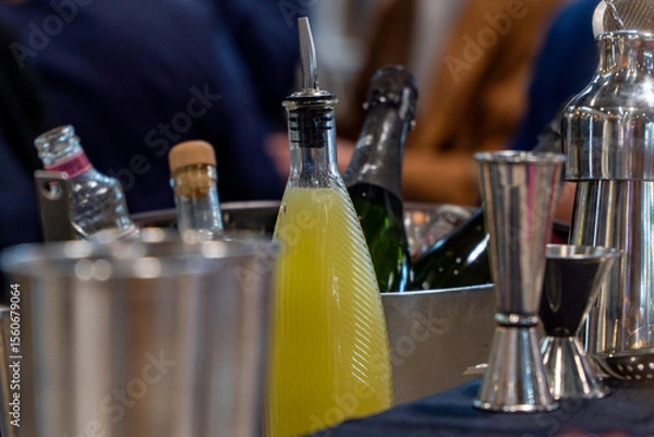Fototapeta Bottle of lemonade ready to use in cocktails on a bar counter