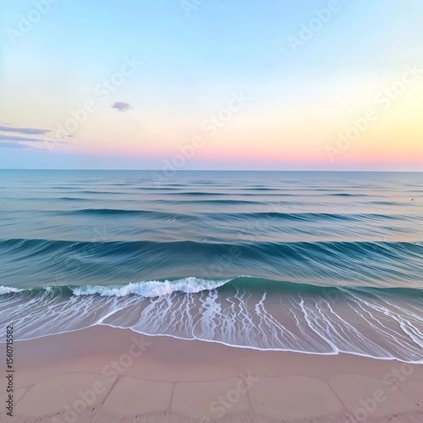 Fototapeta A photo-realistic image of a serene beach during sunset, taken from a bird's eye view. the image features a vast expanse of ocean with gentle waves crashing onto the shore, creating a gentle and calm 