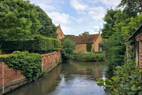 Obraz Groot Begijnhof Leuven, Belgium: Tranquil canal, historic brick buildings, and lush greenery.