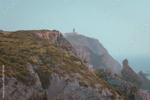 Obraz Lighthouse View from Rugged Coastal Cliff Trail