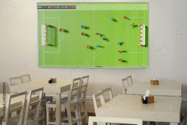 Fototapeta Broadcasting soccer match on TV set in bar