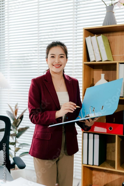 Fototapeta Asian business woman Business document check, account check, document search Legal documents, document preparation, reports, tax analysis, time, accounting, data sheets